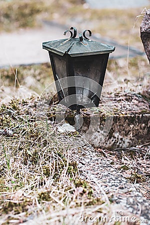 Old garden iron lantern in the forest. Stock Photo