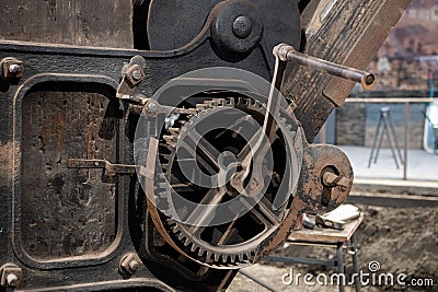 an old gearwheel with crank handle Stock Photo