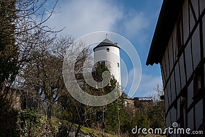 An old German half-timbered house and the view of Kreuzberg Castle Editorial Stock Photo