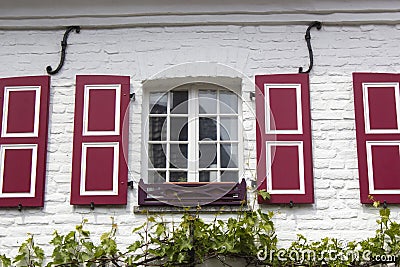 Old German house with windows with wooden shutters, Wachtendonk, Germany Stock Photo