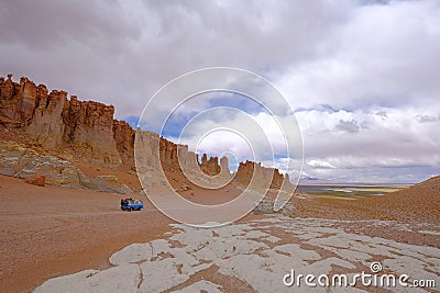 Old german vintage campervan at stone formation Pacana Monks, Monjes De La Pacana, The Indian Stone, near Salar De Tara Stock Photo