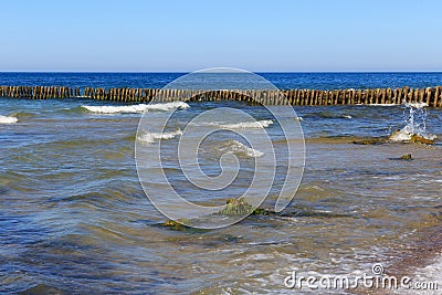 Old german wooden breakwater on the Baltic Sea coast Stock Photo