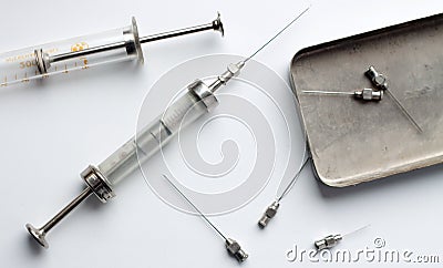 An old glass syringes and a metal box-sterilizer Stock Photo