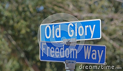 Old Glory and Freedom Way signs in Big Water, Kane County, Utah Stock Photo