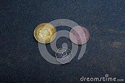 Old Gold Coin Asphalt sharped texture Stock Photo