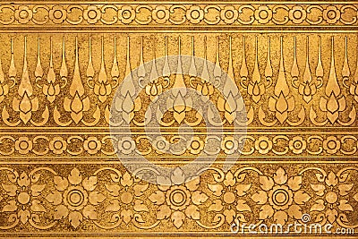 Old Gold Metal Plate with Thai Traditional Carving Stock Photo