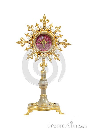 Old gold monstrance with cross inside on white background Stock Photo