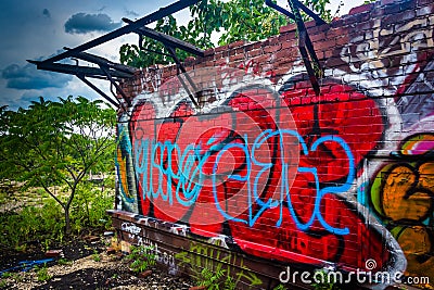 An old, graffiti-covered building at the Reading Viaduct in Phil Editorial Stock Photo