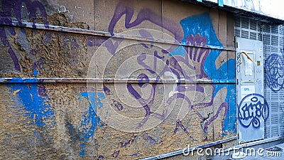 Old graffity wall and steel door Editorial Stock Photo