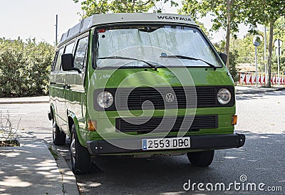 Old green campervan parked on the street Volkswagen T3 Editorial Stock Photo