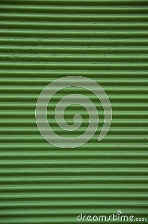 Old green external metal shutter at store closeup Stock Photo