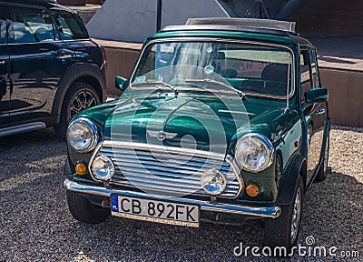 Small green Morris Mini Cooper parked Editorial Stock Photo