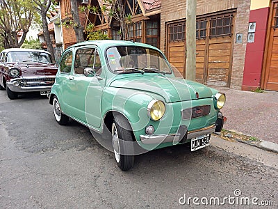 old 1970s Fiat 600 sedan two door rear engined unibody parked in the street. Classic car show Editorial Stock Photo