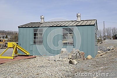 Old green storage shed Stock Photo