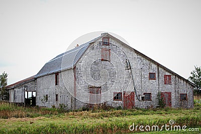 Old grey barn in rural countryside Stock Photo