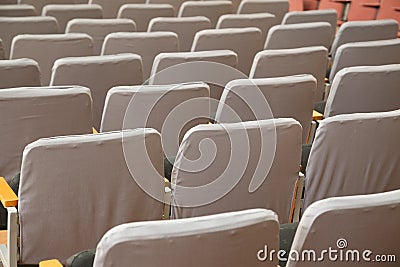 Old grey seats in cinema Stock Photo