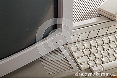 Old grubby outdated tech. Close-up of a vintage computer system. Stock Photo
