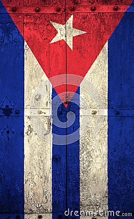 Old grunge cuban flag on broken crack wood door with rift, havana cuba communist dictatorship Stock Photo