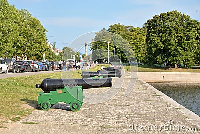 Old guns on the embankment in Kronstadt. Editorial Stock Photo