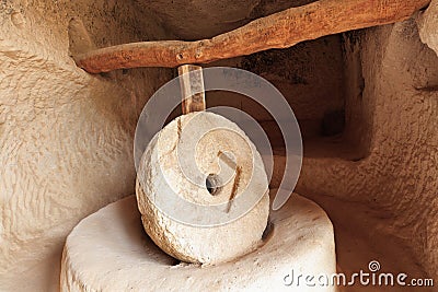Old stone millstones in one of the ancient caves of the red valley of Cappadocia Stock Photo