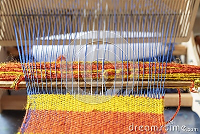 An old hand loom. Handloom. Fabric production Stock Photo