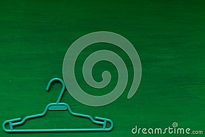 Old hangers clothing on a green background 1 Stock Photo