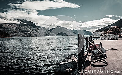 Old harbor in Queenstown in the background with Lake Wakatipu Editorial Stock Photo