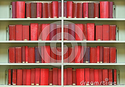 Old hardcover books on shelf Stock Photo