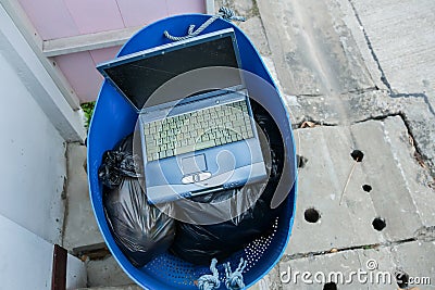 Old hardware put into container. Damaged Hardware Equipment In Dustbin. Stock Photo