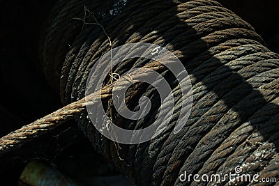 Old hawser on the drum of a windlass or winch Stock Photo