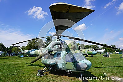 Old helicopter at the aircraft exhibition in the open space, helicopter blade in the foreground, military equipment exhibition, Editorial Stock Photo