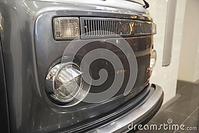 old hippie minibus, front of a stylish old camper, headlights, radiator grille Stock Photo