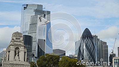 Old historic building on background of modern skyscrapers. Action. Contrast of architecture of buildings of different Stock Photo