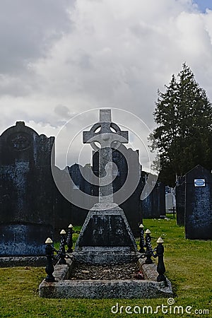 Old historic grave tomb with celtic cross in Glasnevin cemetery, Dublin. Stock Photo