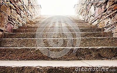 Old historic stone stairs, leading up to the sun lights Stock Photo