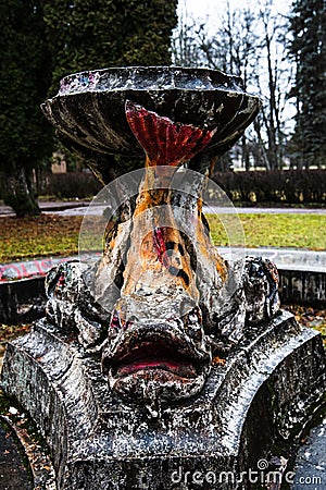 Old, historical, abandoned non - working fountain with fish sculptures, Baldone, Latvia Editorial Stock Photo