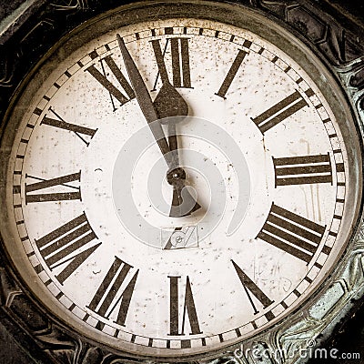 Old historical clock, the hands of which are on shortly before twelve Editorial Stock Photo