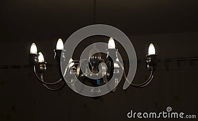 old historical eight-armed chandelier. silver single with spruce cone Stock Photo