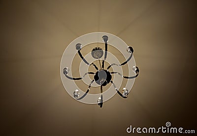 old historical eight-armed chandelier. silver single with spruce cone Stock Photo