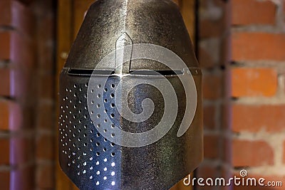 Old historical medieval iron knight helmet armor for ancient warriors protection in combat. Traditional past fighter Editorial Stock Photo