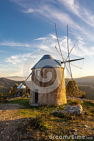 Old Historical Stone Windmill at Sunset in Portugal Stock Photo