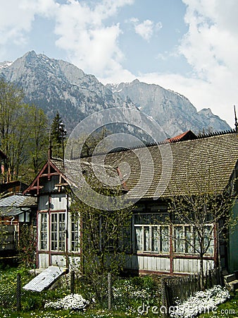 Old house and Caraiman mountain Stock Photo