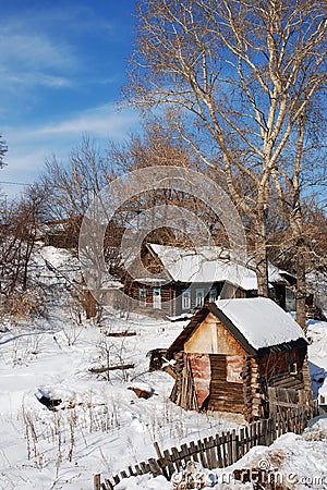 Old house and bathhouse in winter. Stairs on background Stock Photo