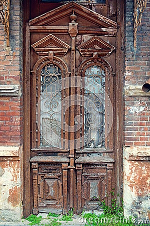 Cracked red paint on old vintage wooden door Stock Photo