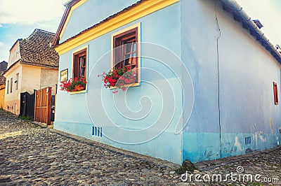 Old house with flowers window Stock Photo