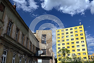 Old house next to rebuild block of flats Stock Photo