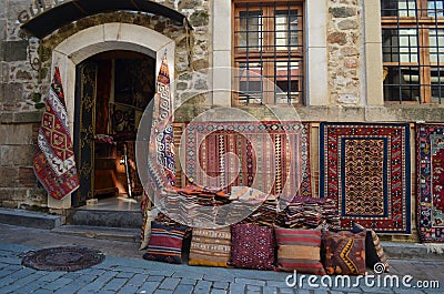 Old house with a shop in it sellling different interesting local carpets Stock Photo