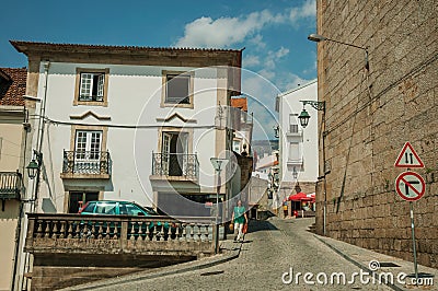 Old house with stone decoration in a deserted alley Editorial Stock Photo