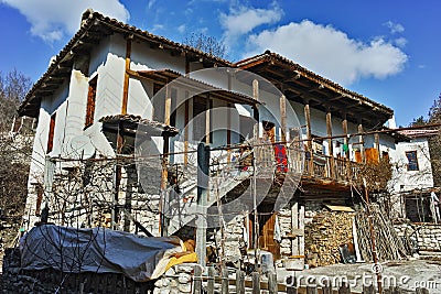 Old house with wooden porch in village of Rozhen, Bulgaria Stock Photo