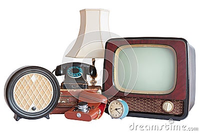 Old household items: TV, radio, camera, alarm, phone, table lamp Stock Photo